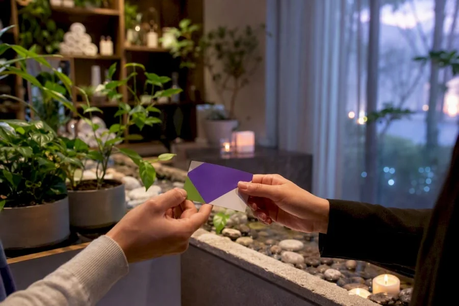 Hands showing wellness studio membership perks card
