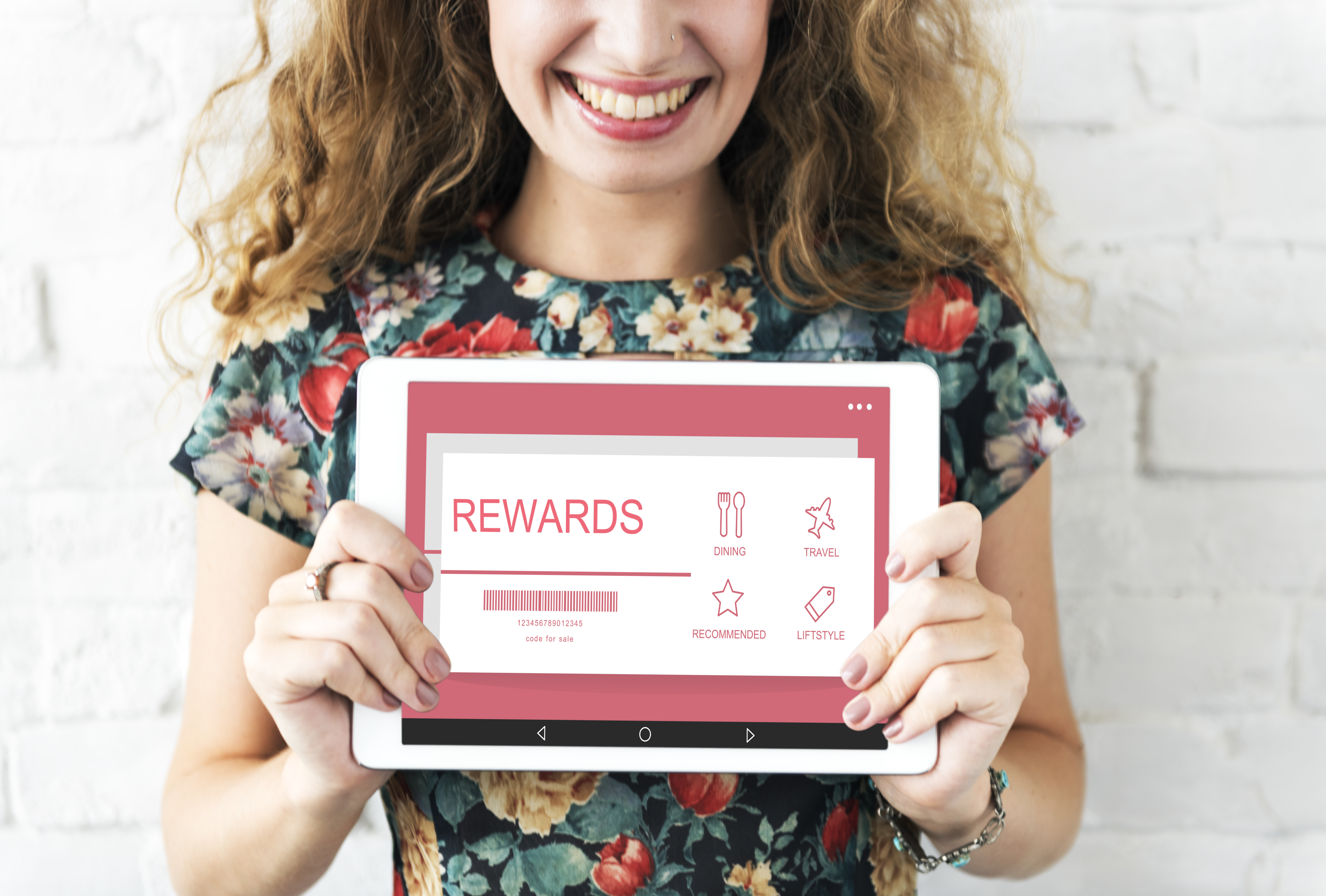 the woman shows her earned rewards