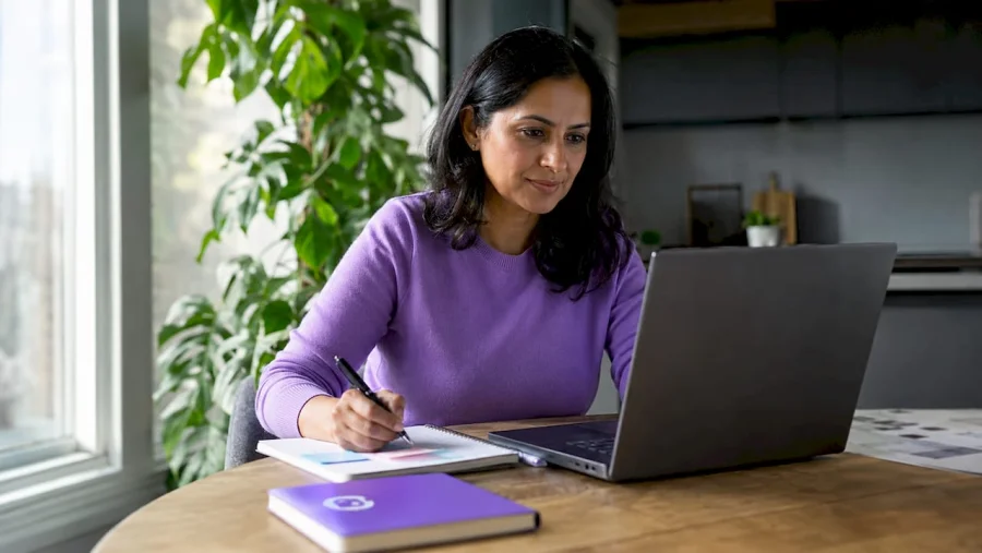 Woman working on laptop email campaigns